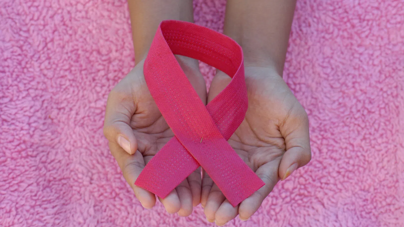 a person holding a heart shaped object