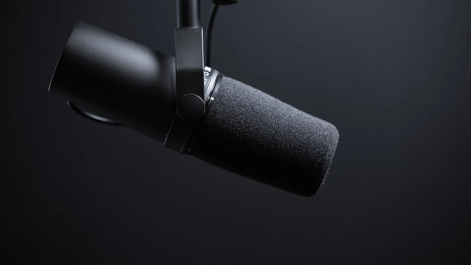 a black microphone with a black background