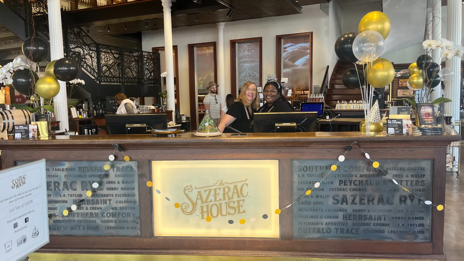 a group of people behind a bar