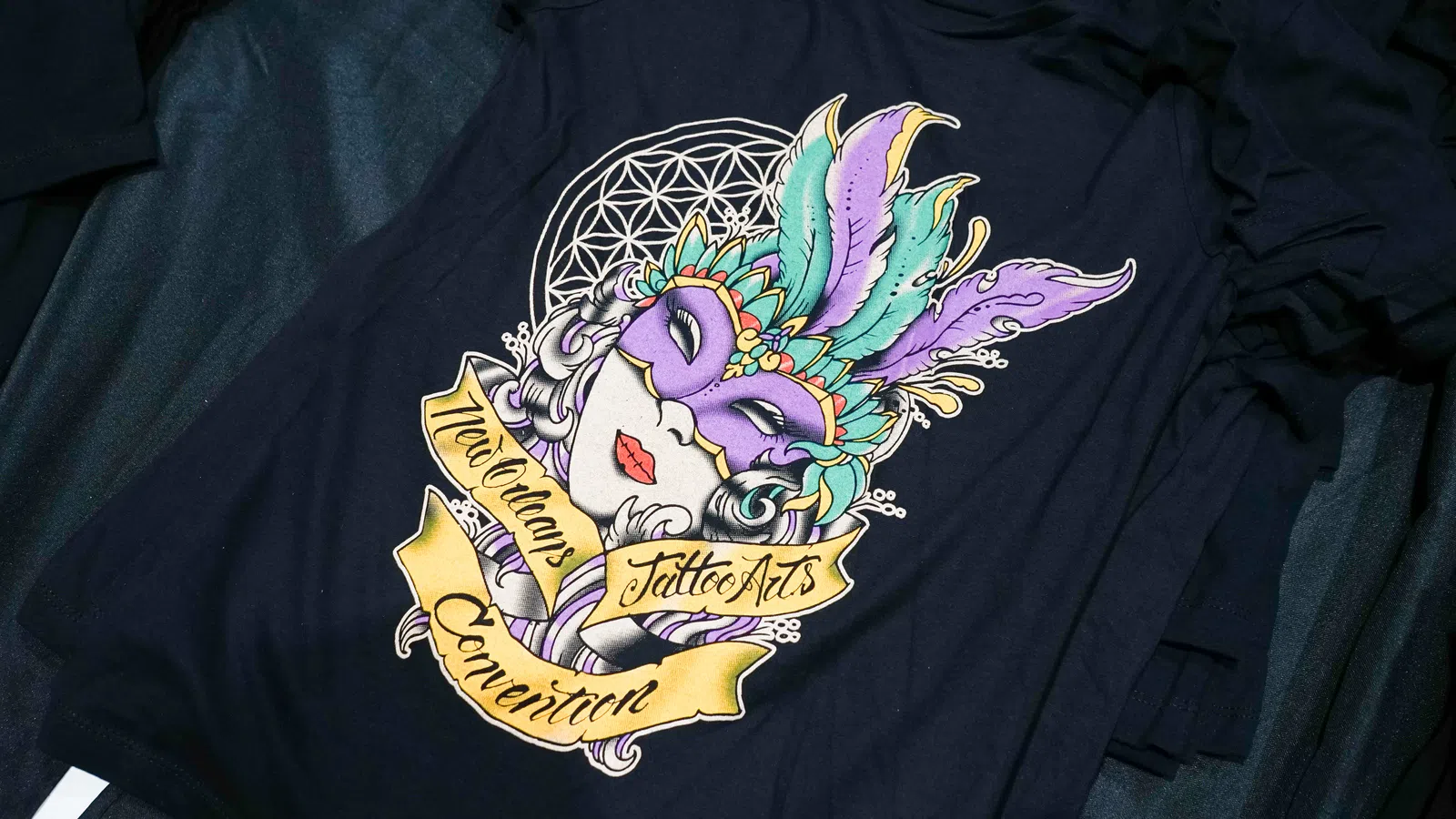a blue shirt with a graphic design on it
