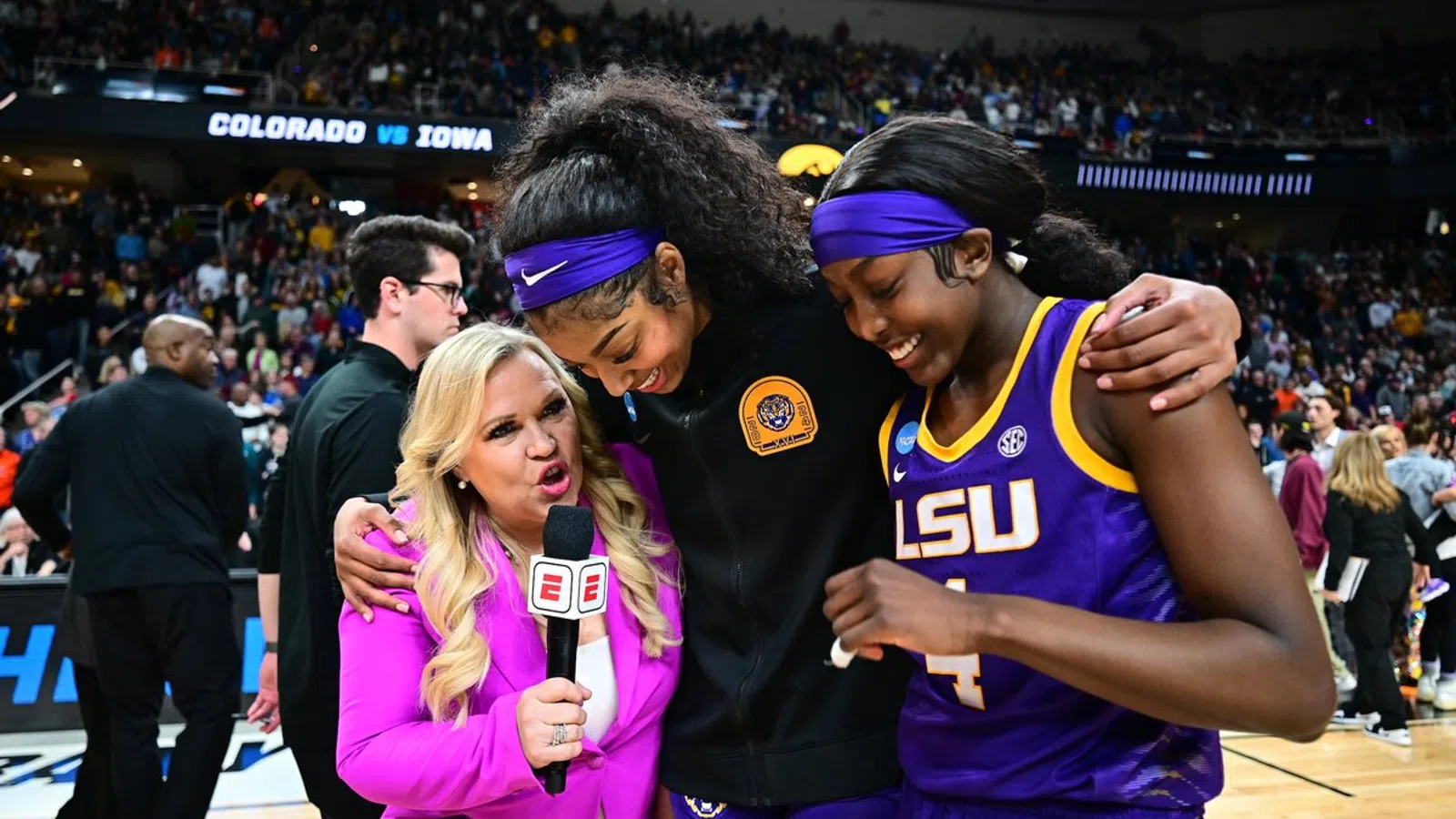 Holly Rowe et al. in a stadium