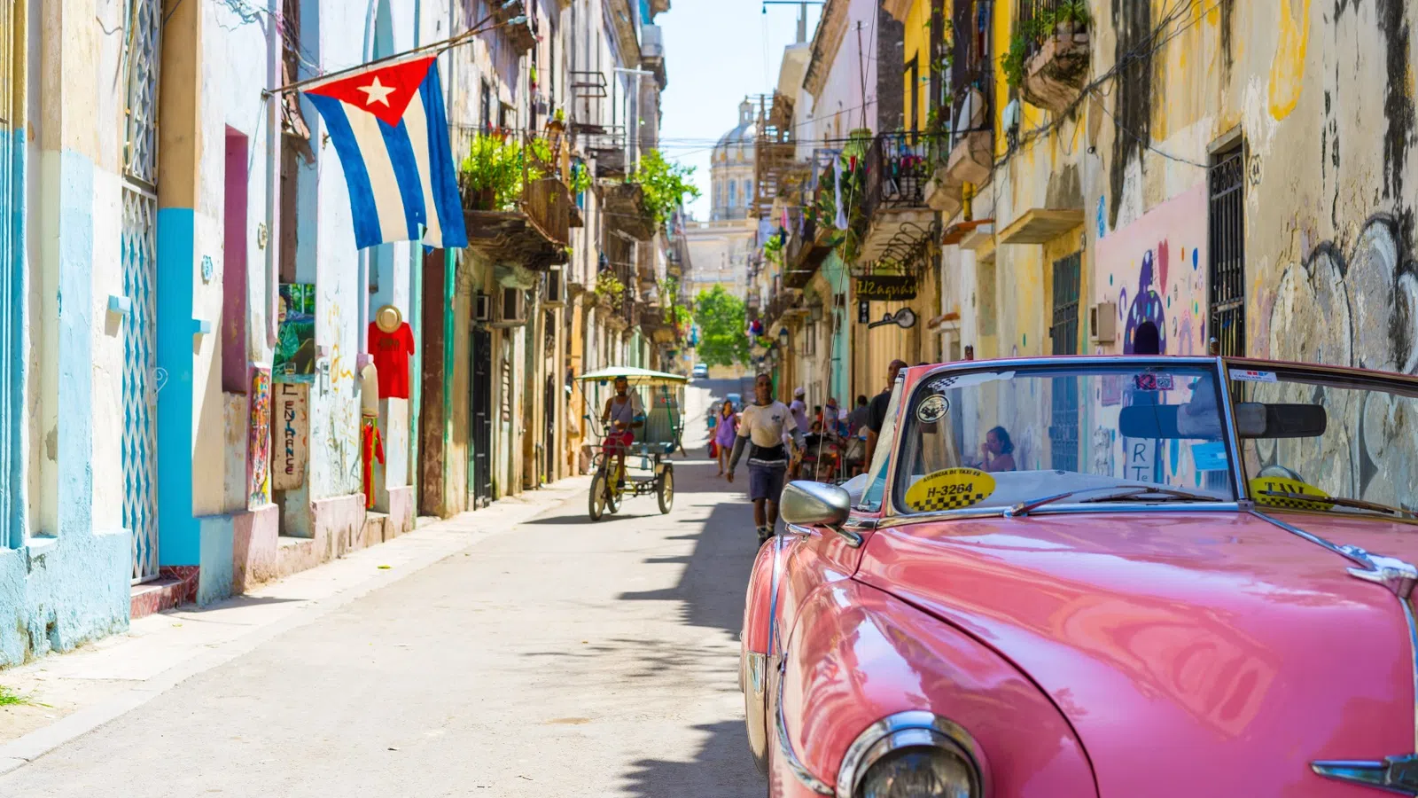 a pink car parked on a street