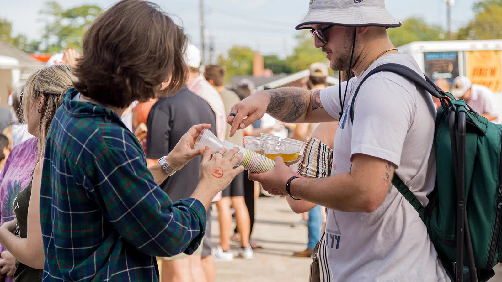 a man and woman holding a container of food