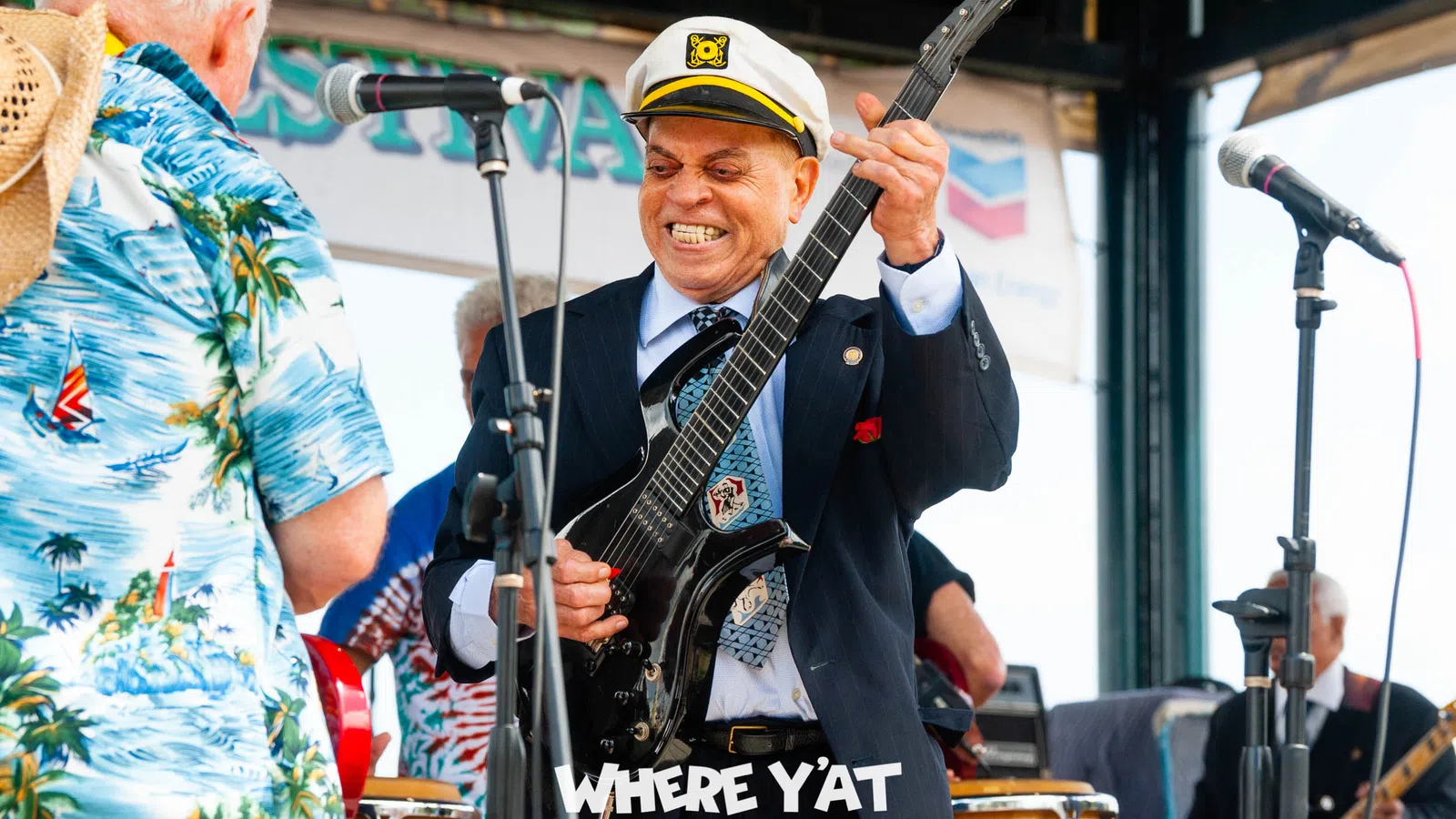 Deacon John Moore playing a guitar