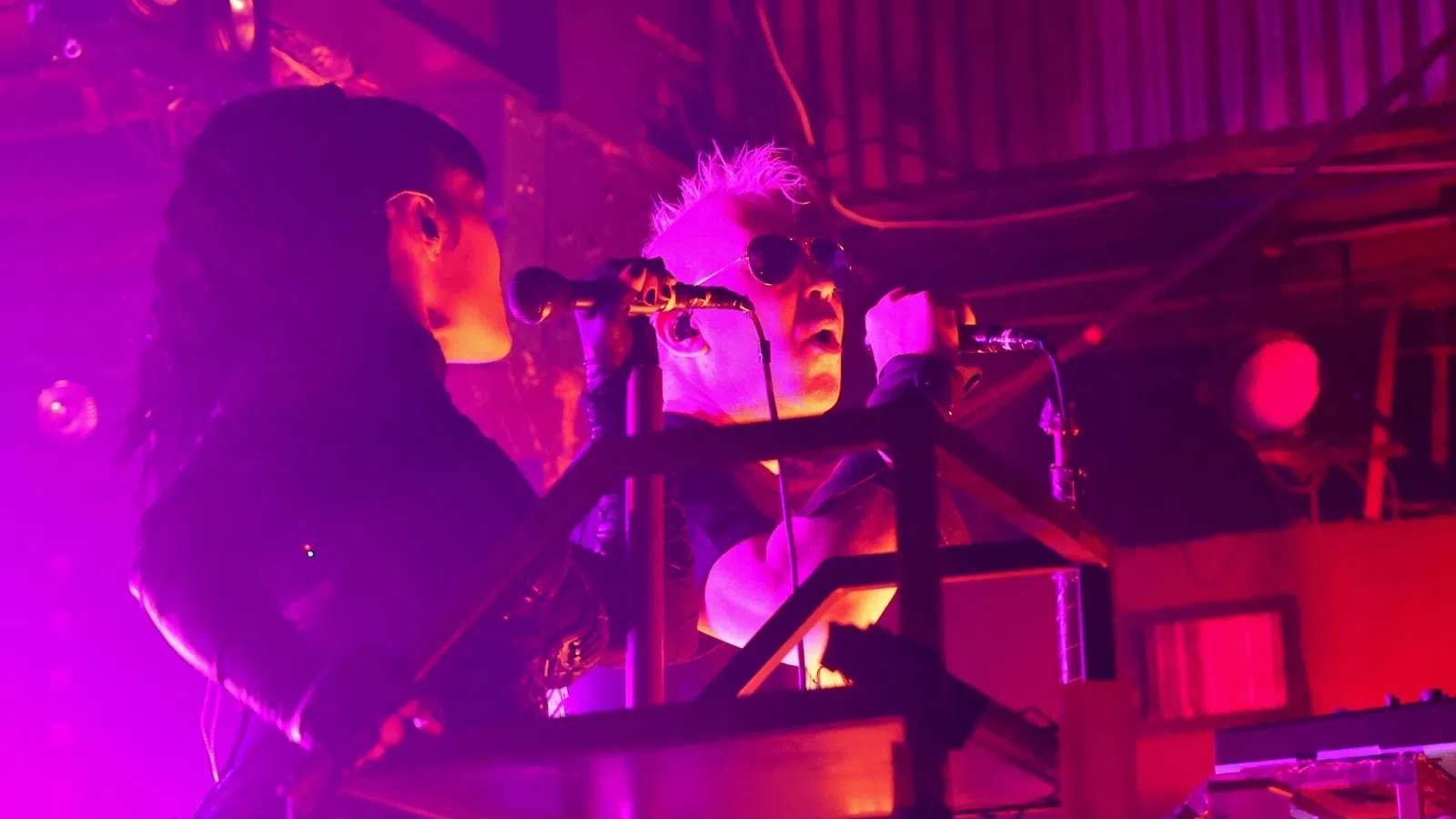 a couple of men playing musical instruments