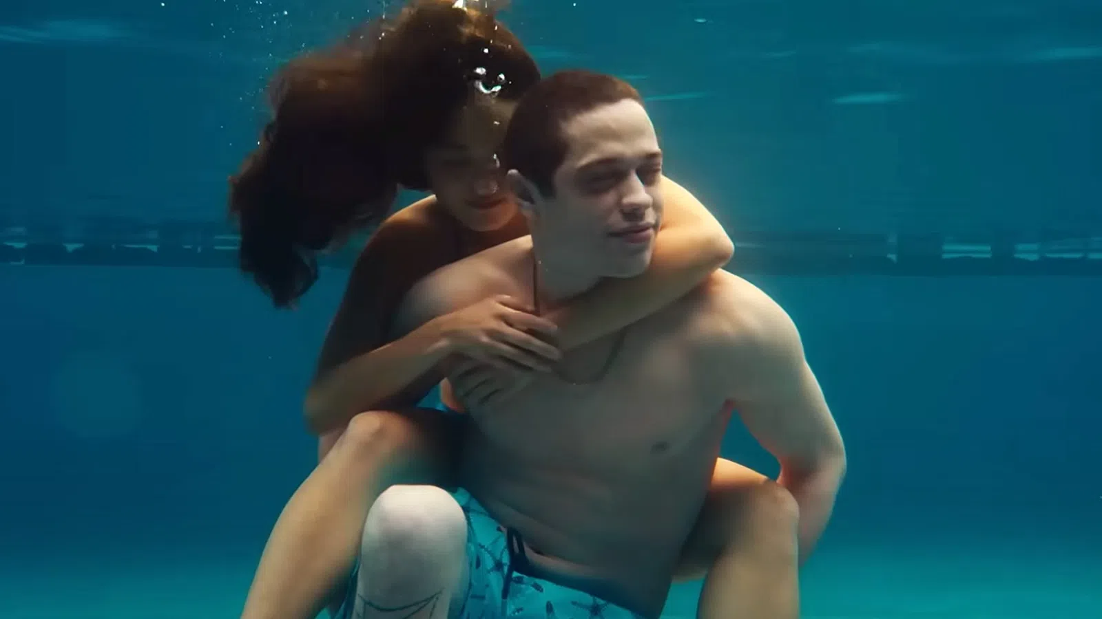 Pete Davidson and woman hugging