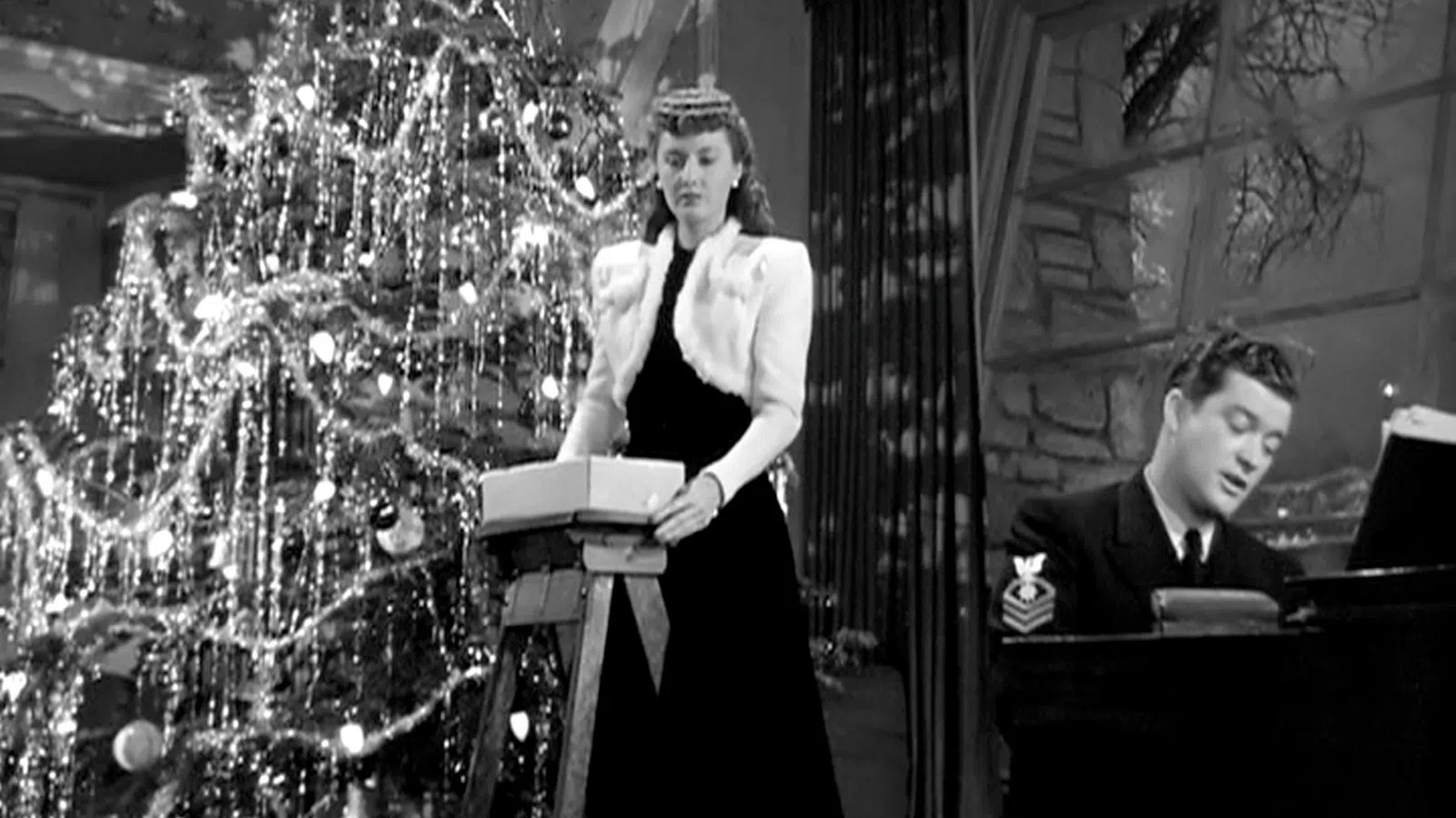 Dennis Morgan standing at a podium