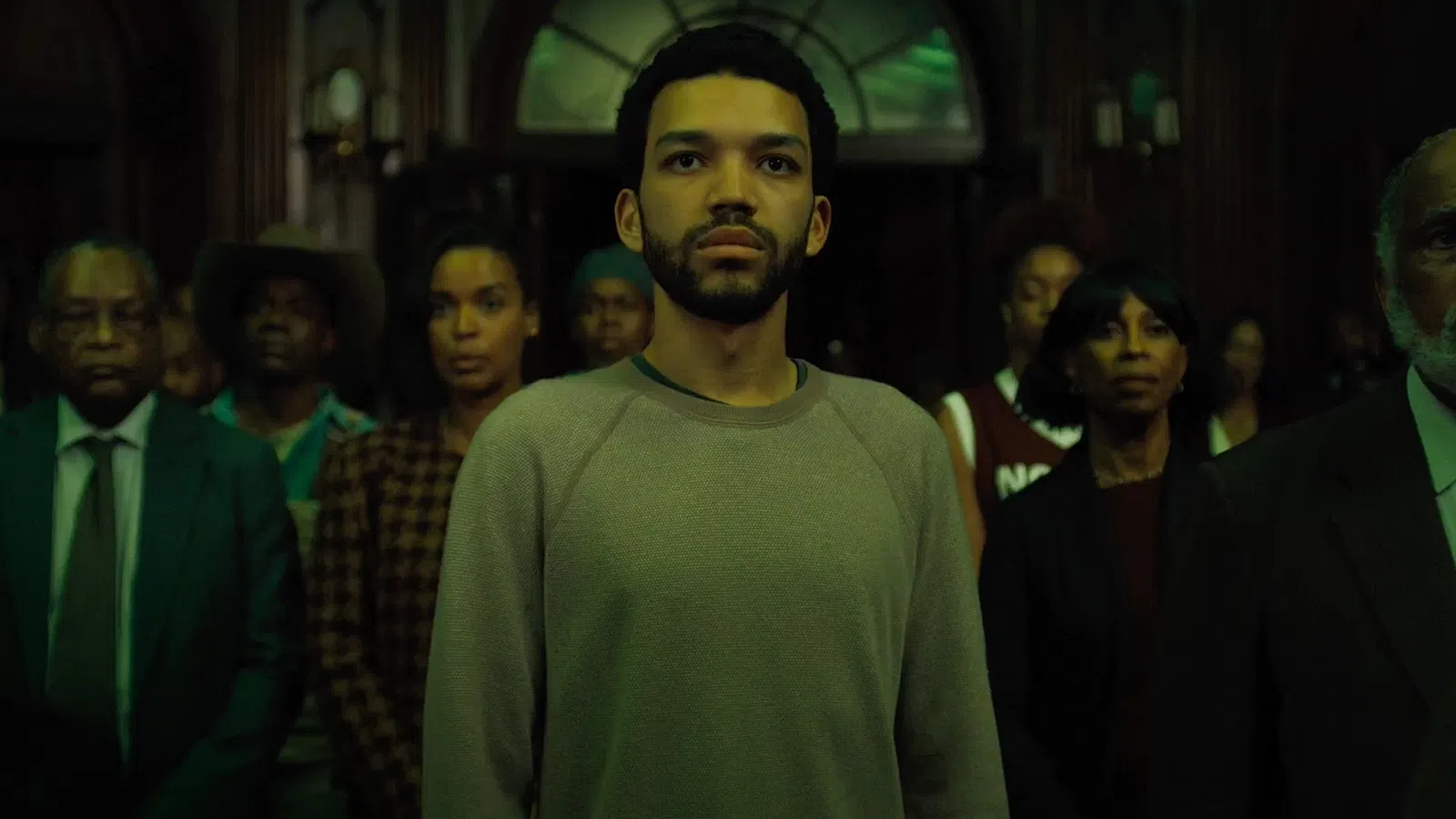Justice Smith in a green shirt
