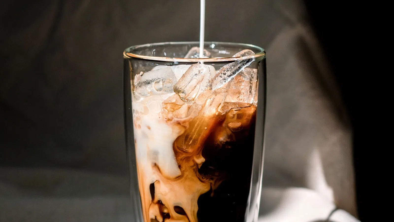 a glass with a drink in it