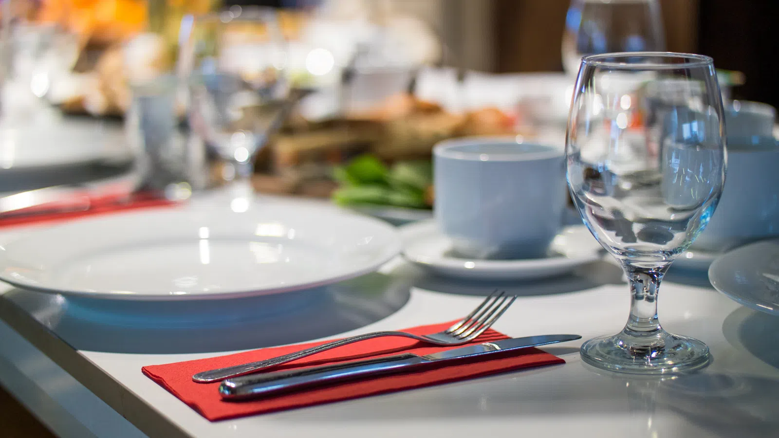 a table with plates and glasses