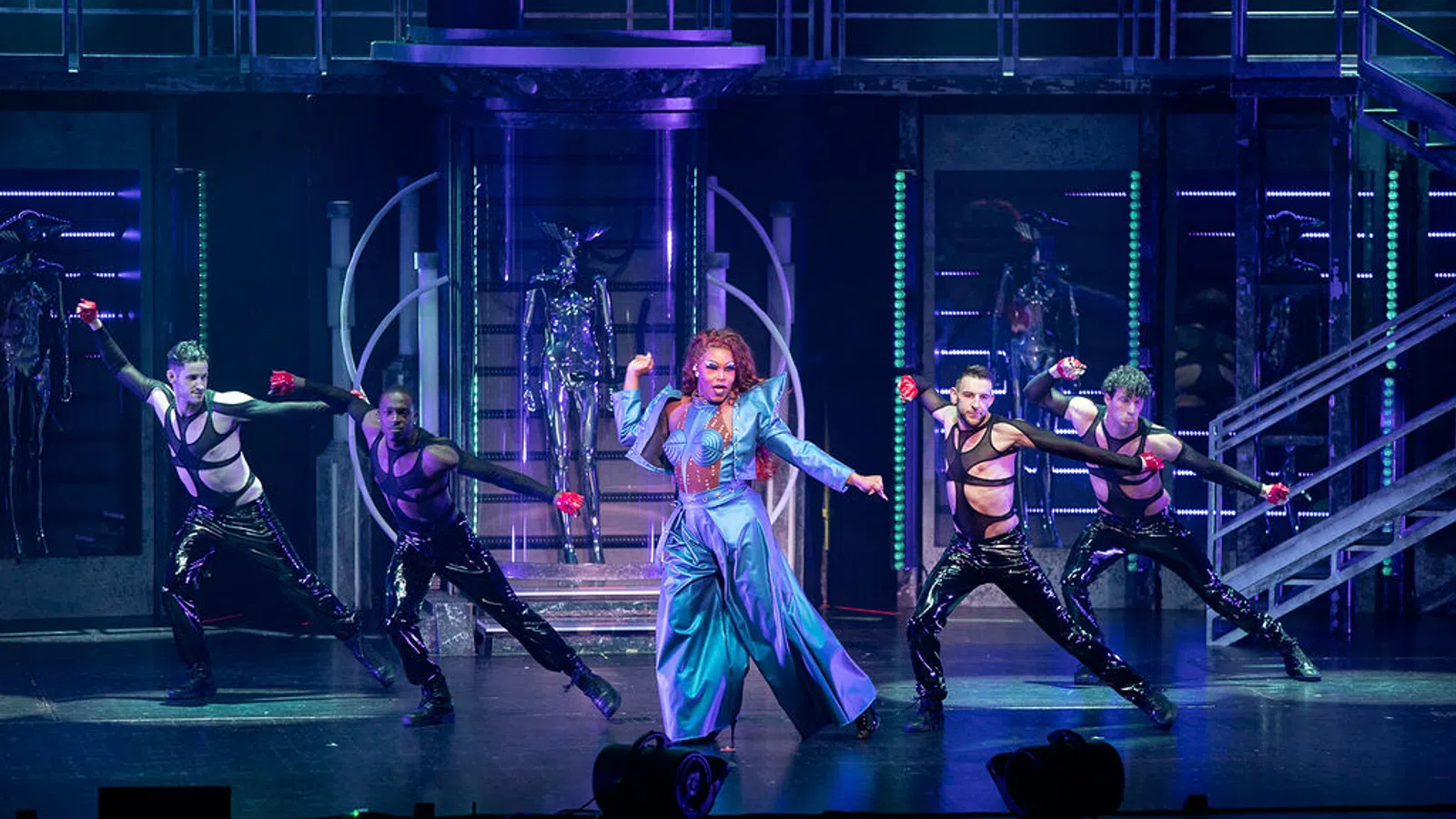 a group of people dancing on a stage