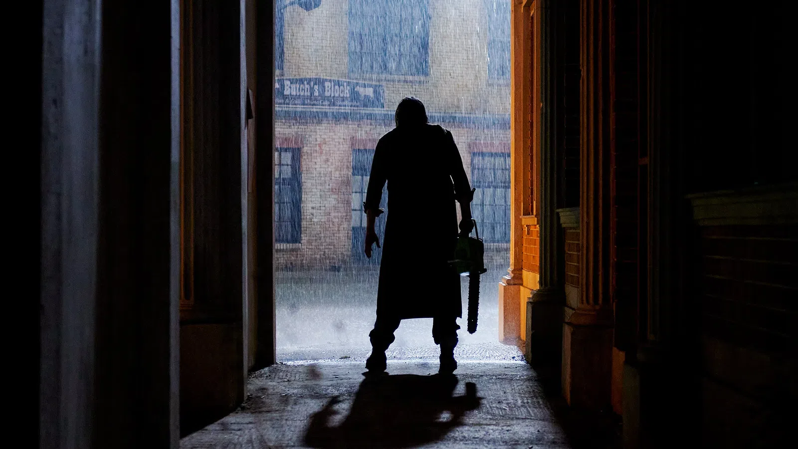 a man walking through a hallway