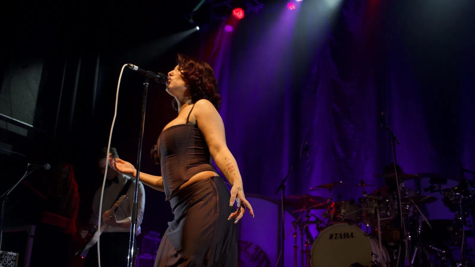 a person singing into a microphone