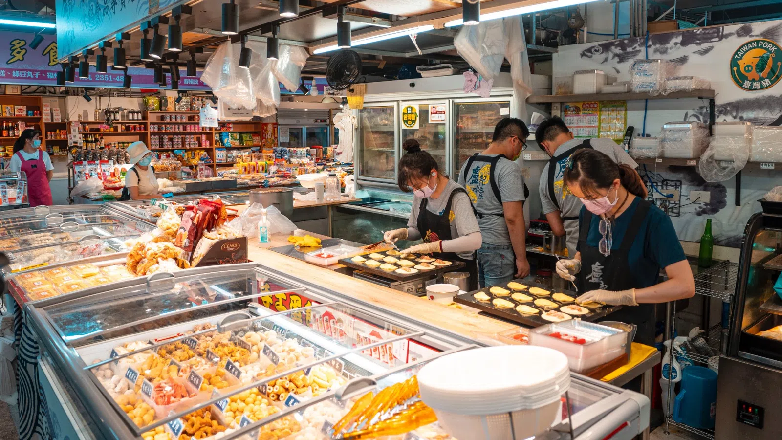 people standing in a food market