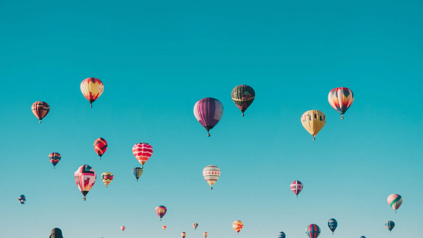 a group of hot air balloons in the sky