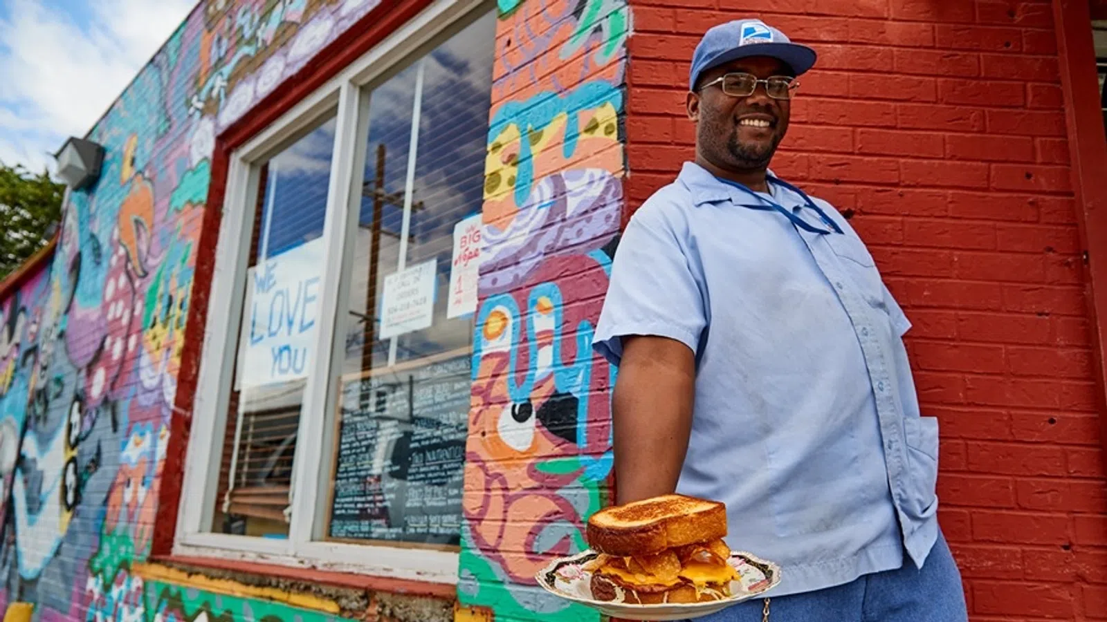 a person holding a plate of food