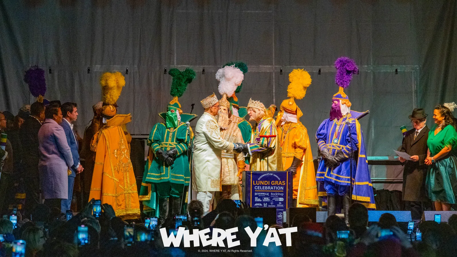 a group of people in clothing on a stage