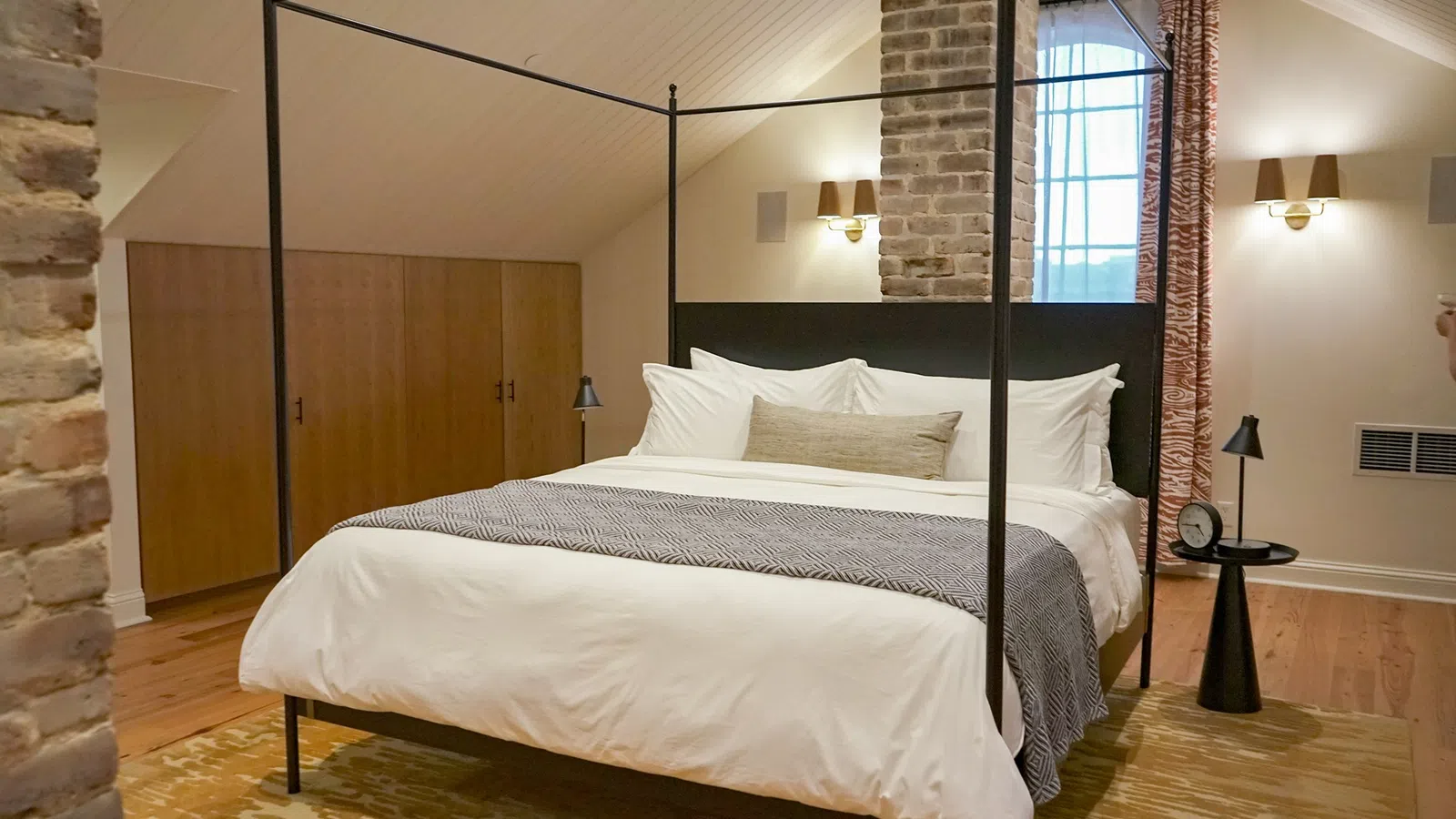 a bed with a large mirror