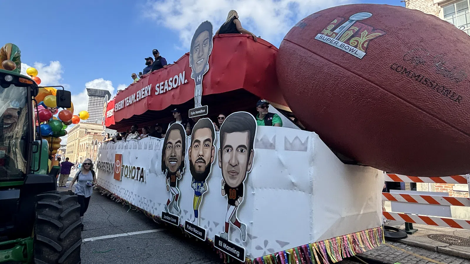 a truck with a large red balloon on the back