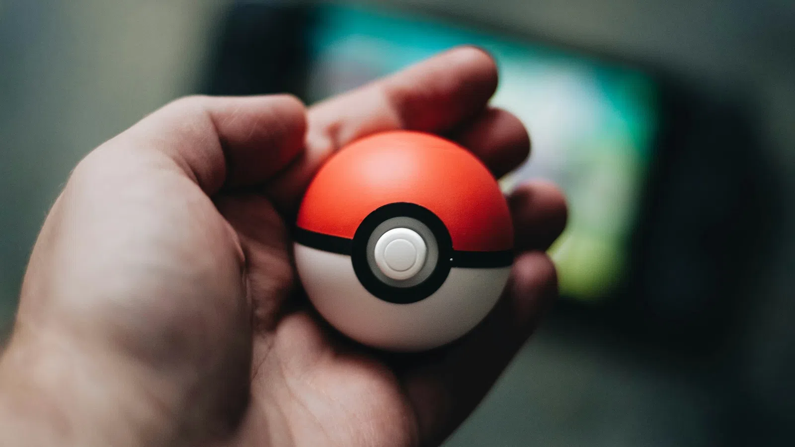 a hand holding a ball