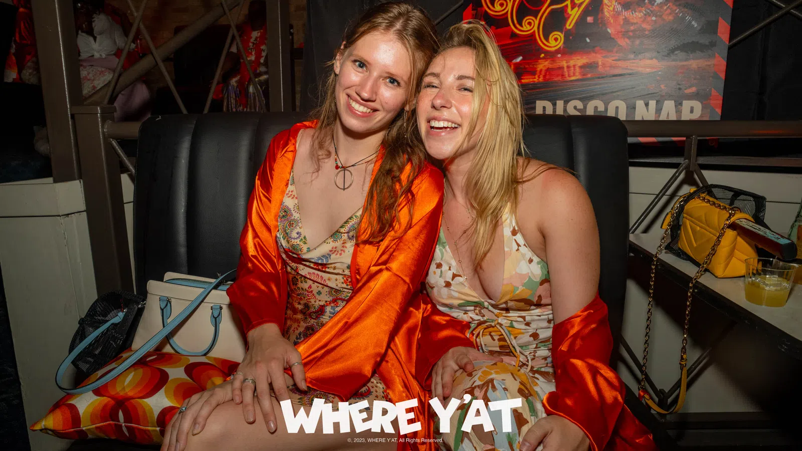 two women sitting on a couch