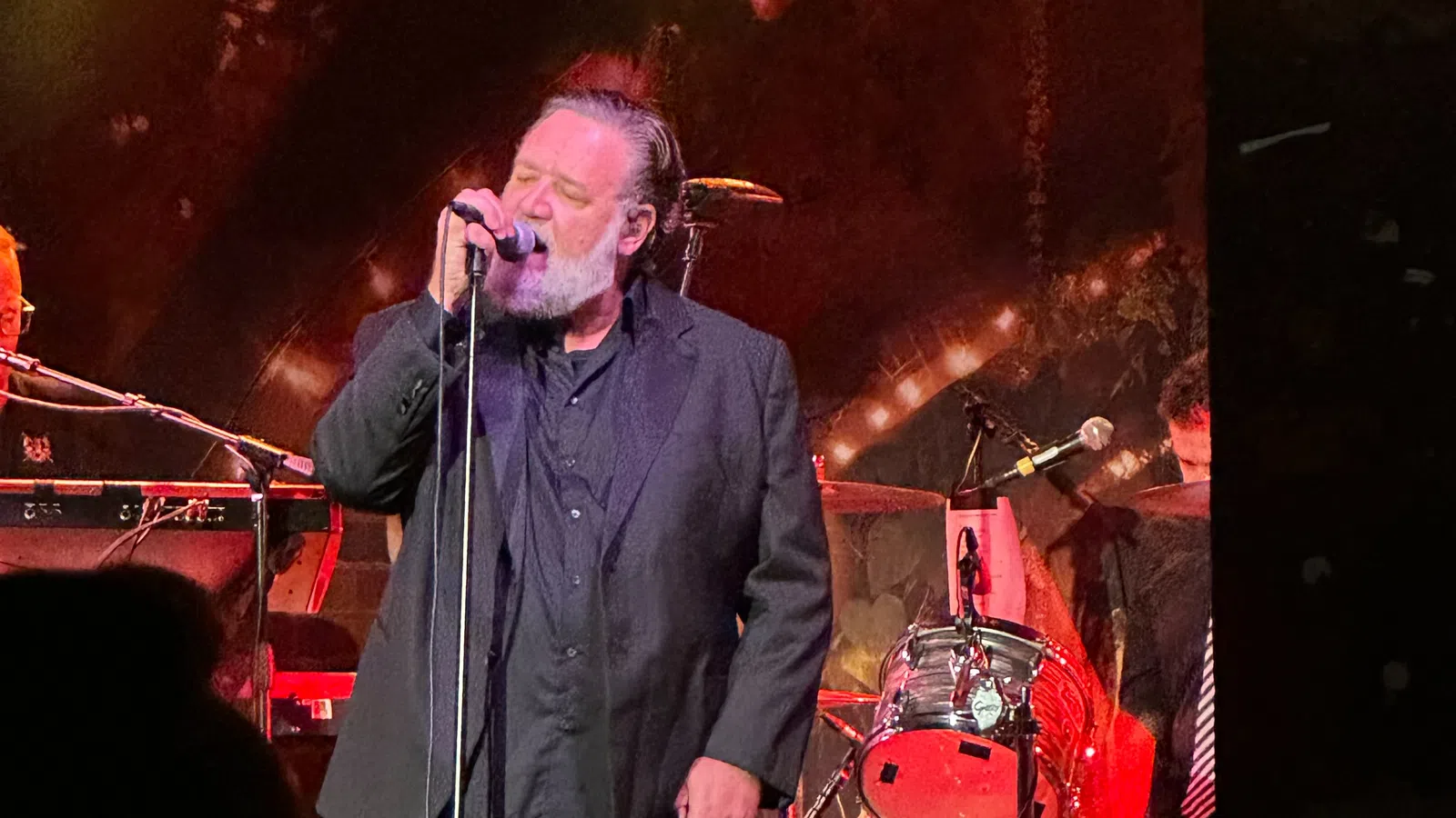 a man singing into a microphone
