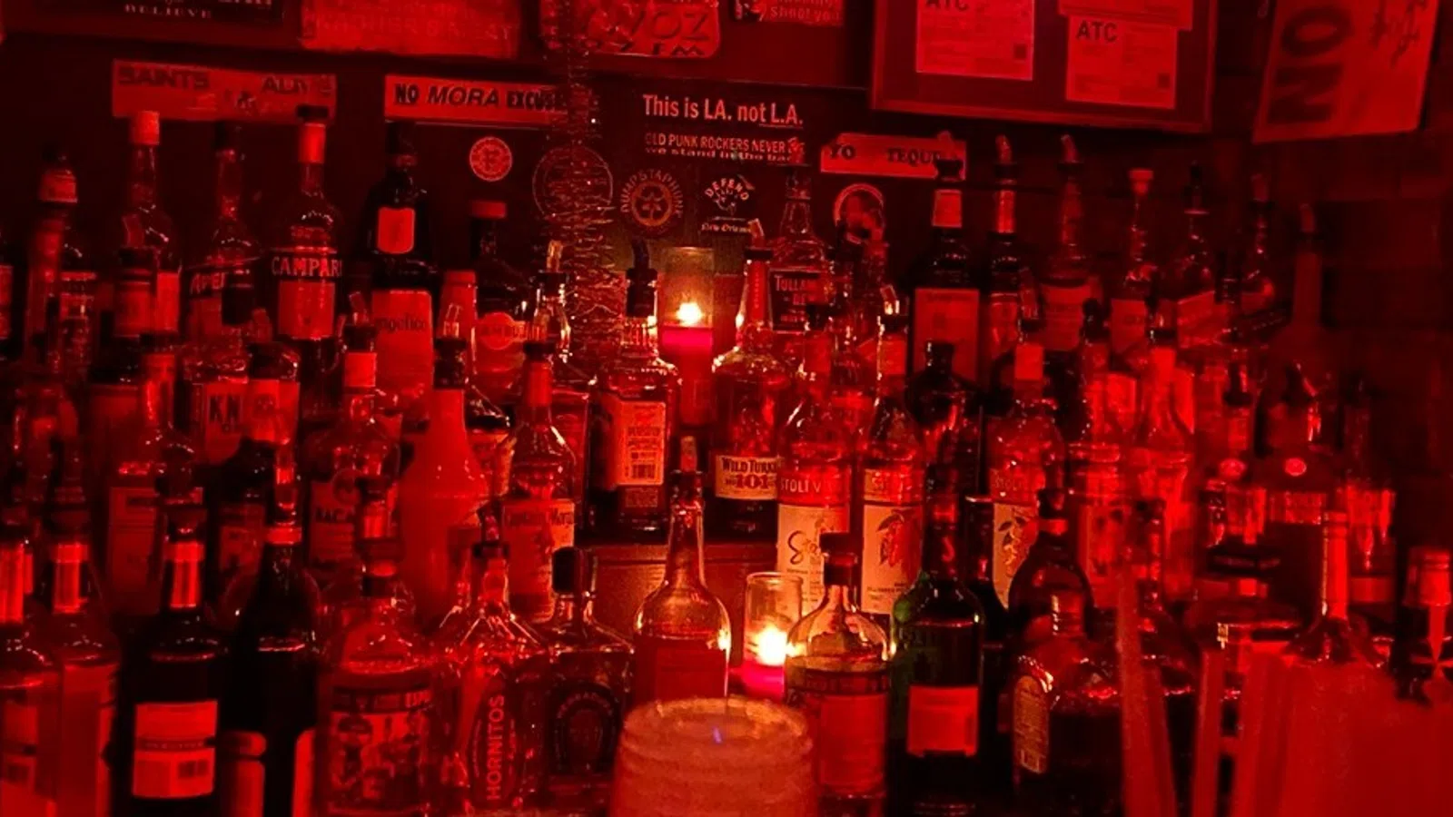 a bar with many bottles of alcohol