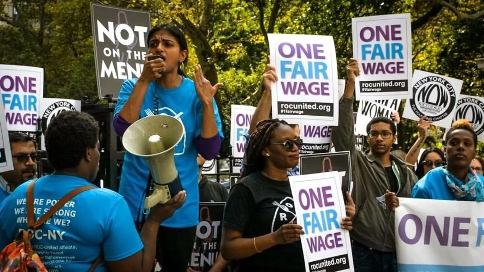a group of people holding signs