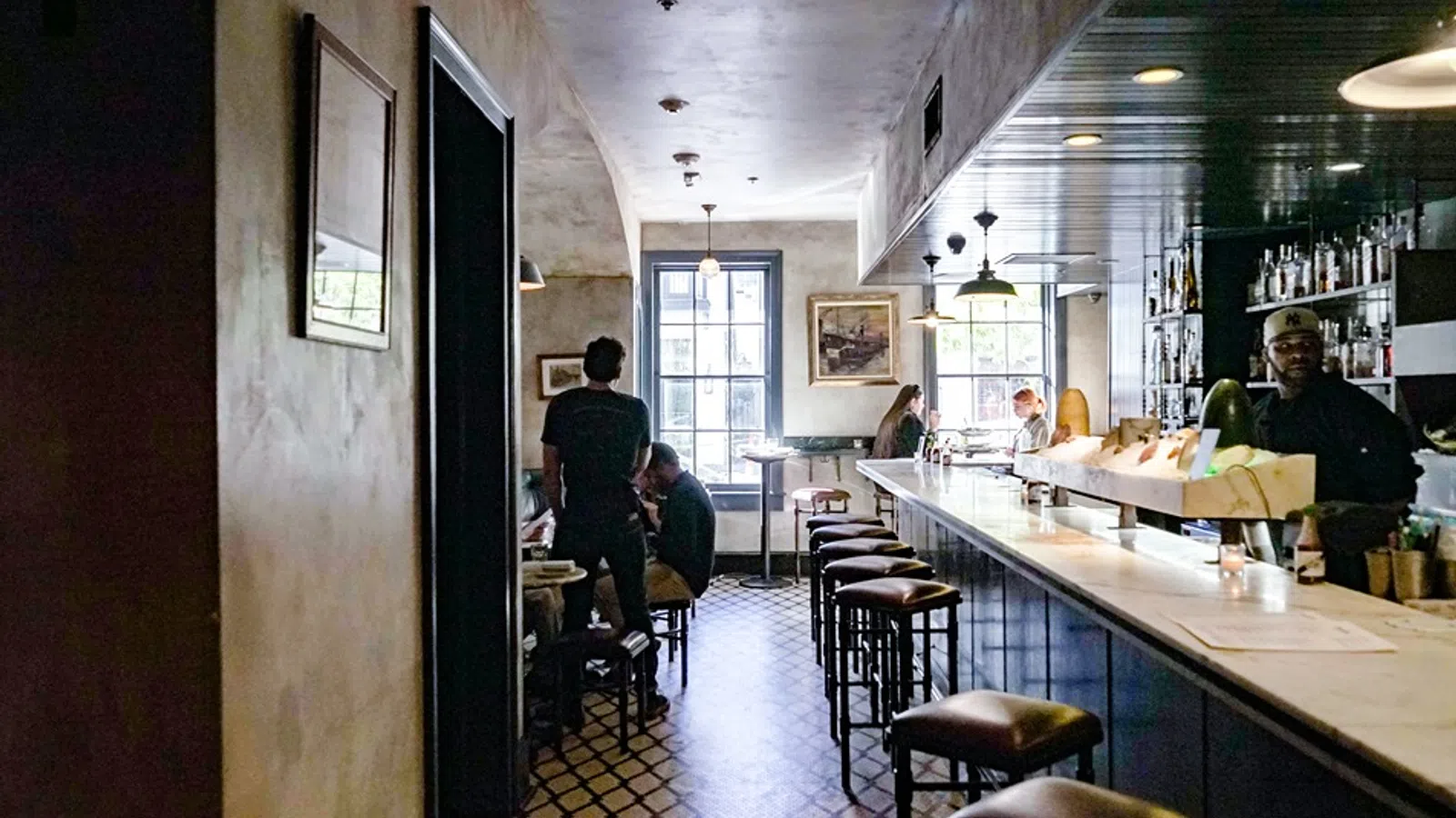 a restaurant with a bar and stools