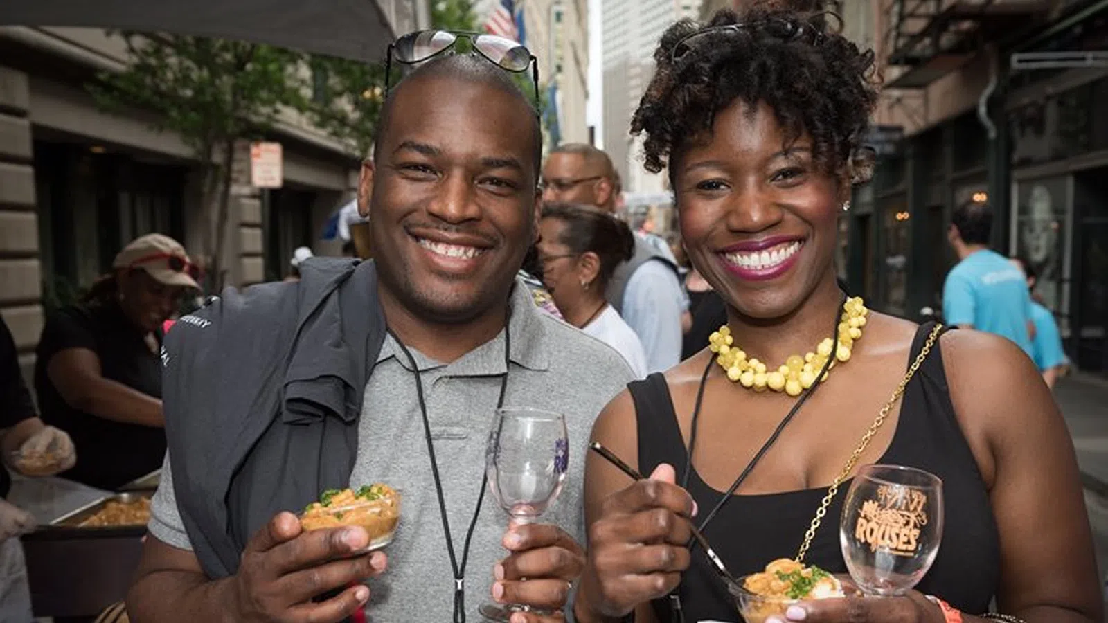 a man and woman holding drinks