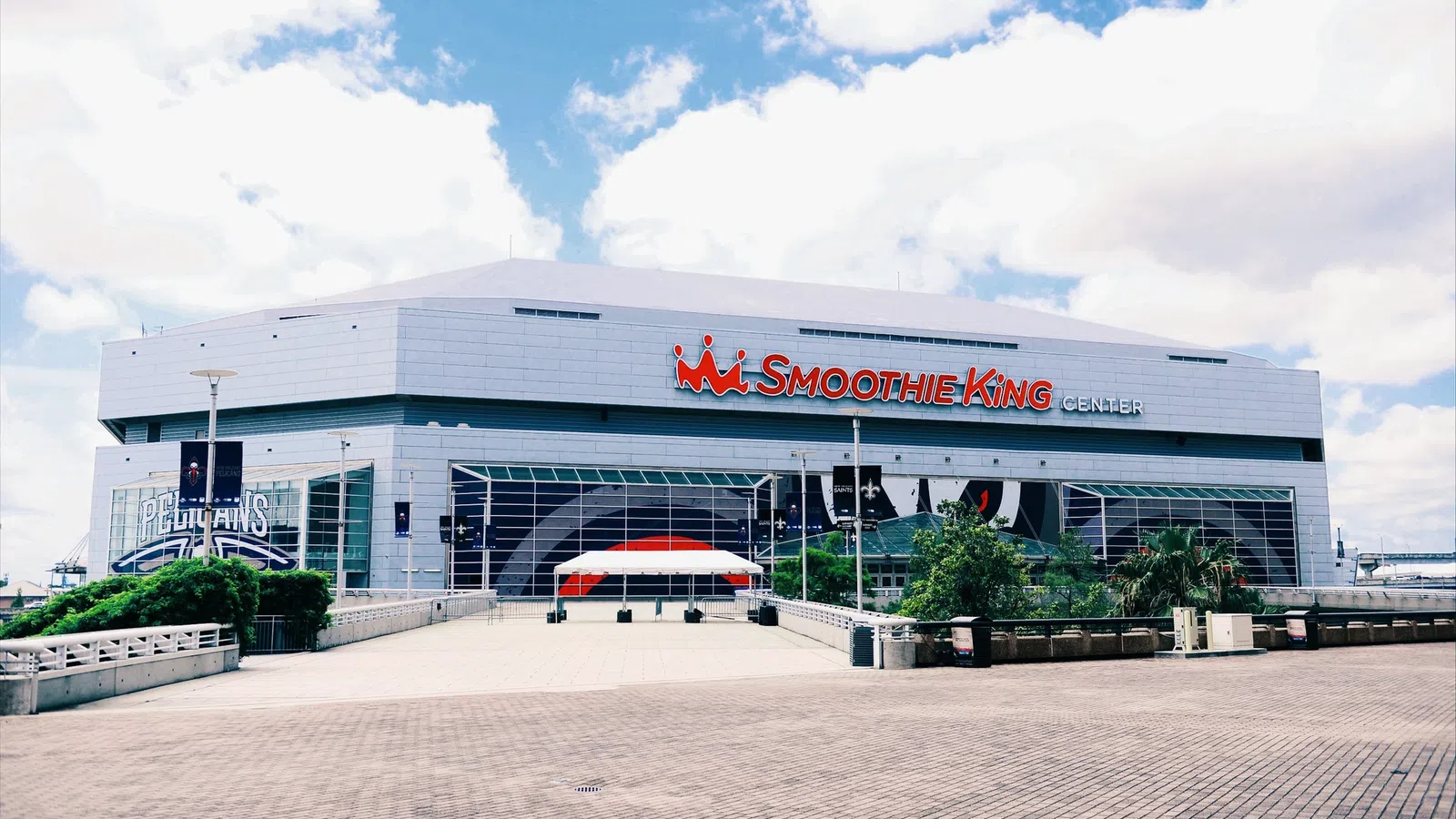 Smoothie King Center arena with signage and clear sky in New Orleans, Louisiana