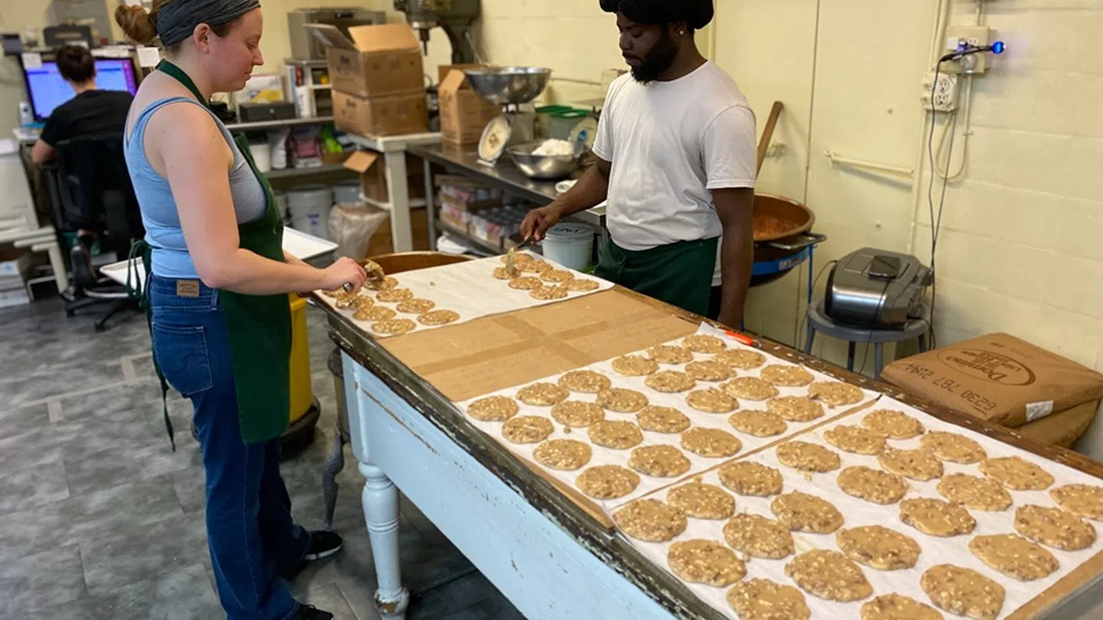 a man and a woman preparing food