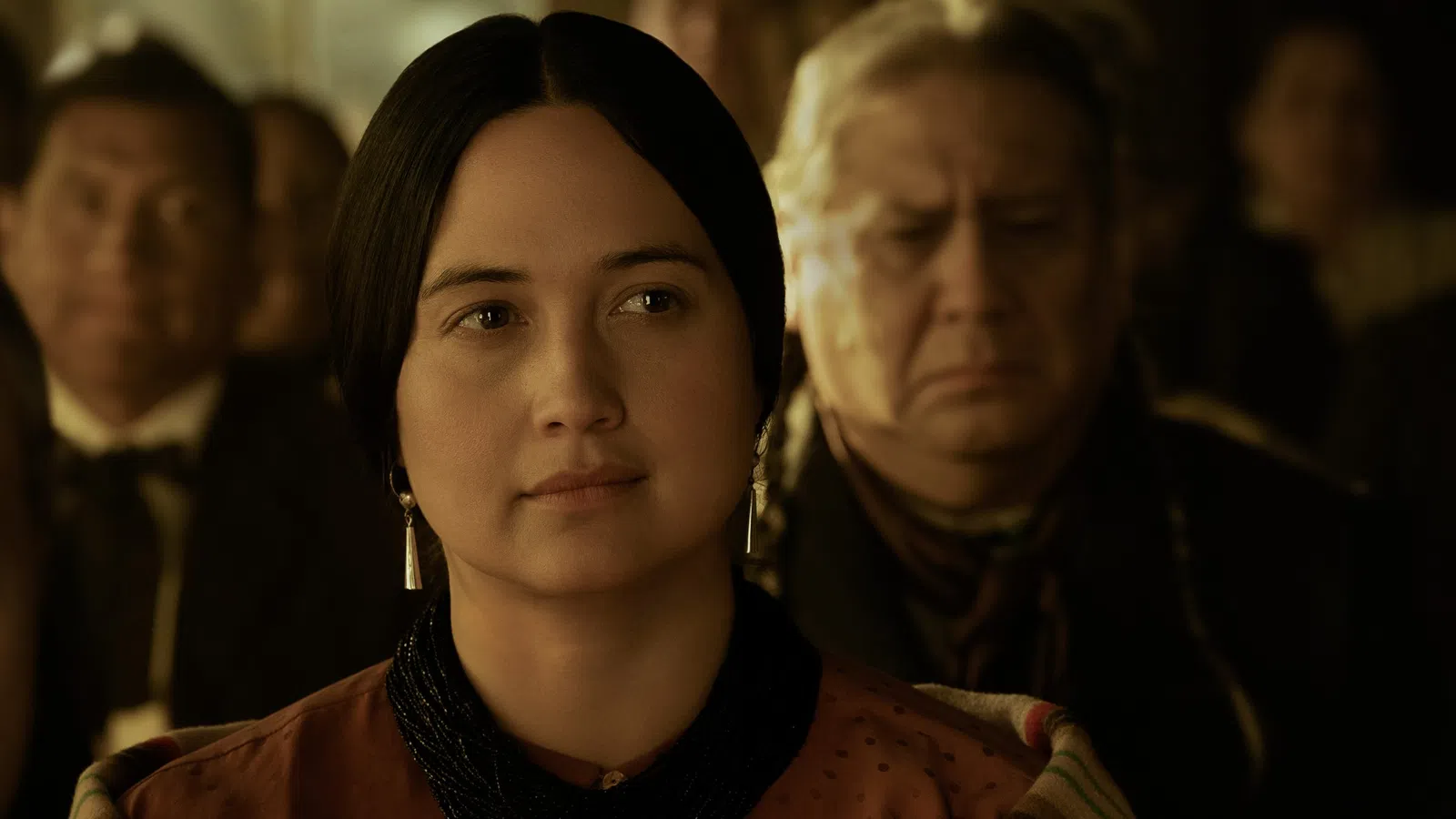 Lily Gladstone looking at the camera