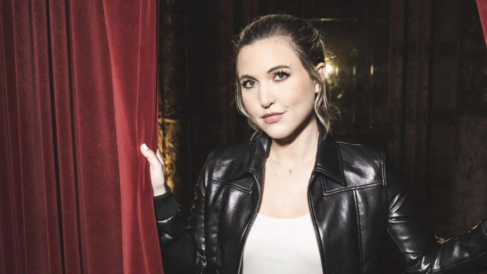 a woman in a leather jacket