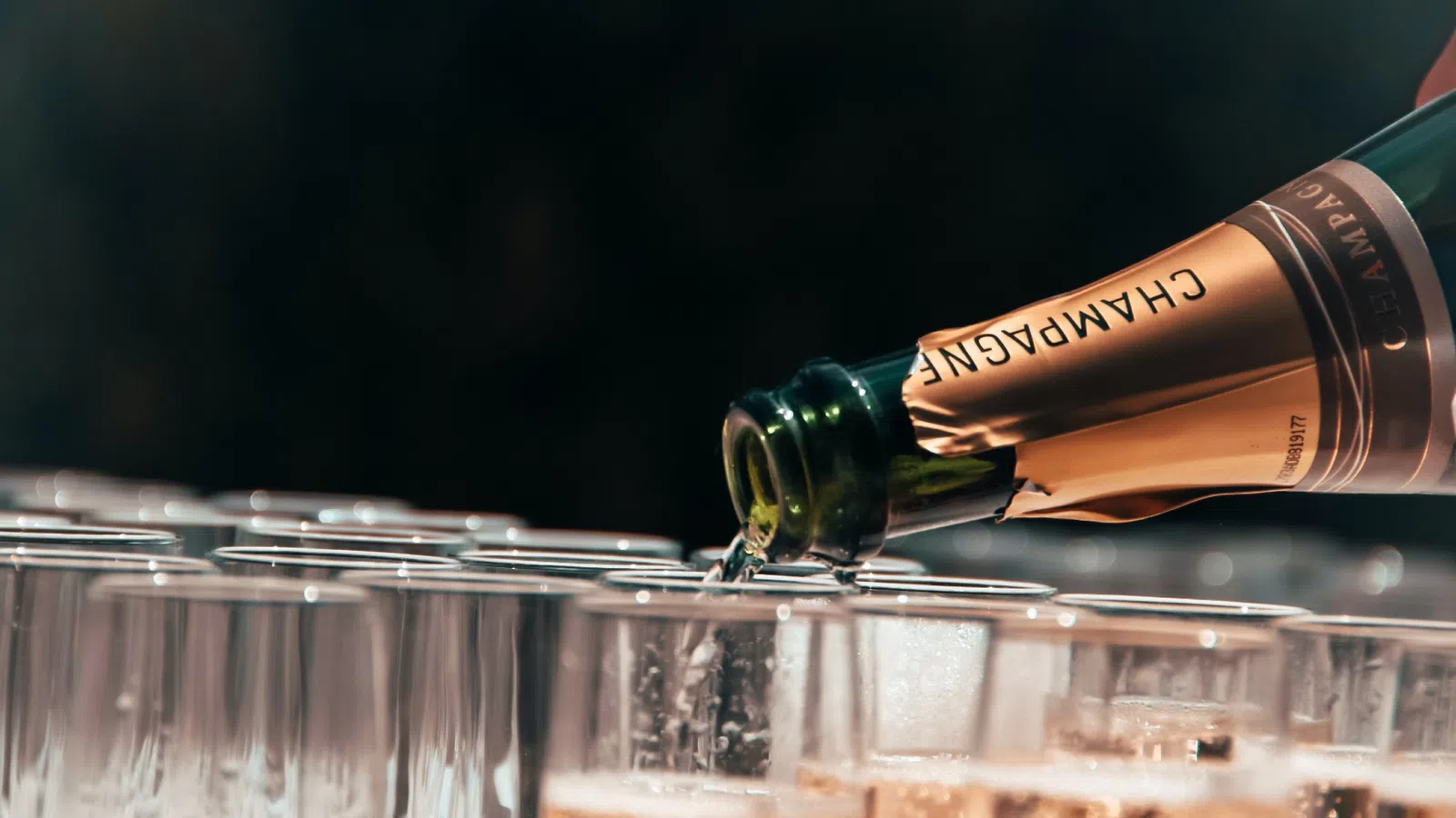 a bottle of wine and several glasses