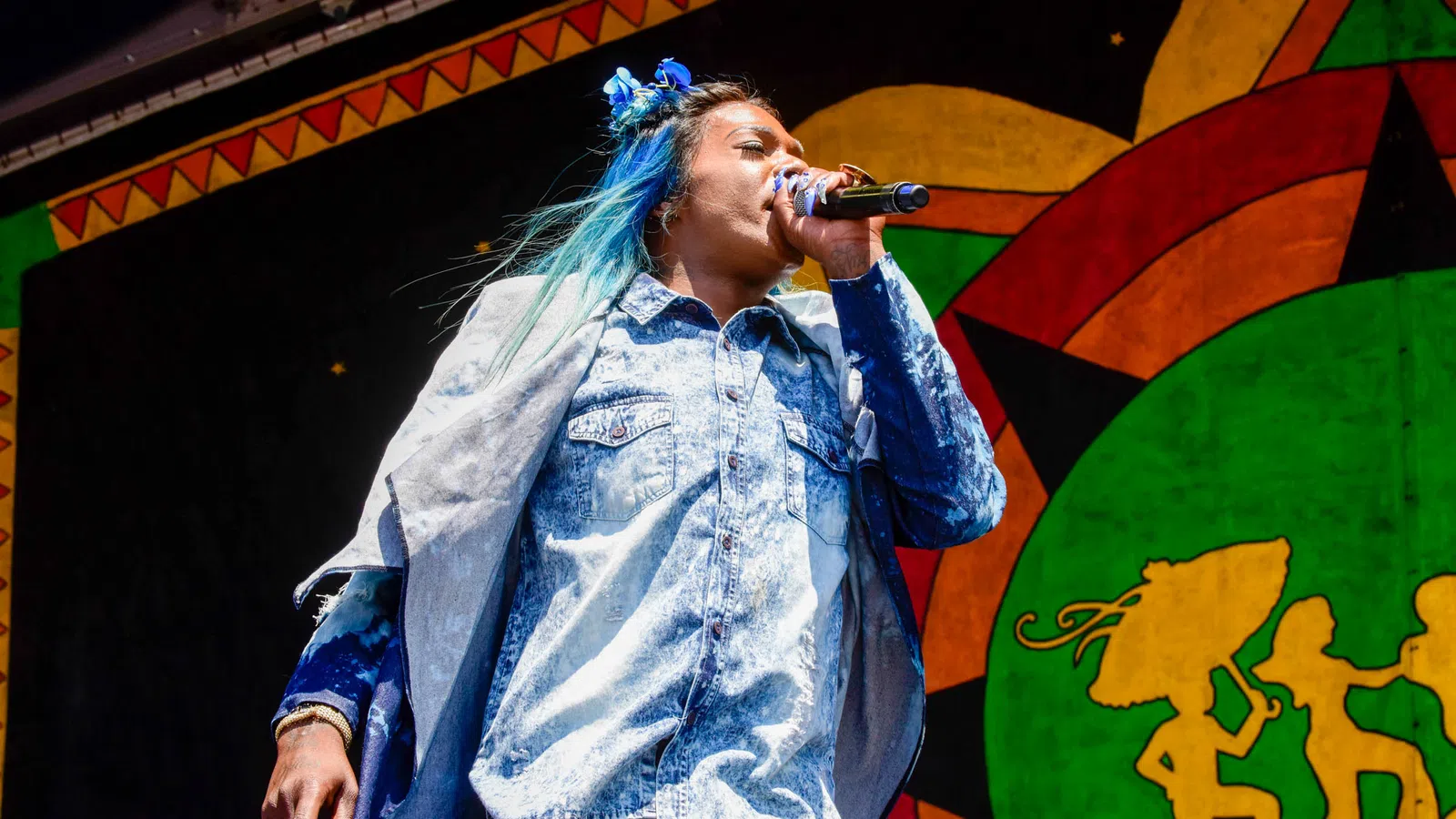 a person singing into a microphone