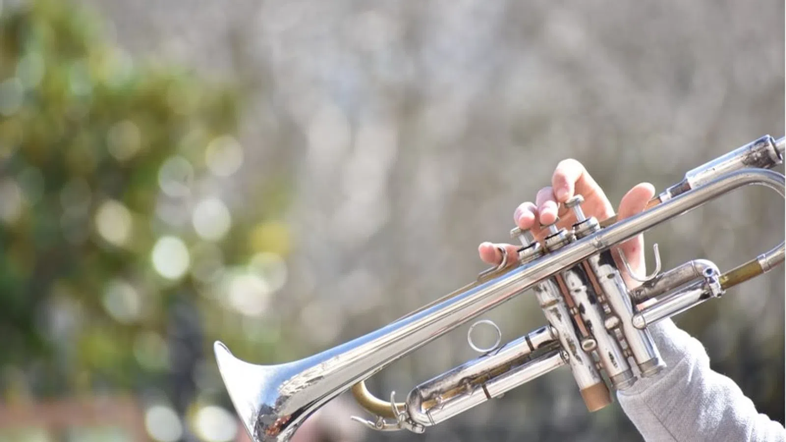 a person playing a trumpet