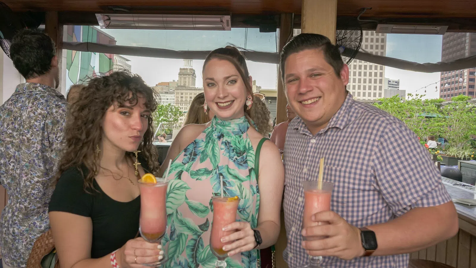 Kendra Sayles et al. holding drinks