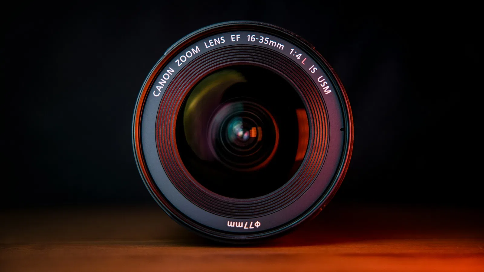 Canon EF 16-35mm f/4L USM zoom lens showcased against a dark background.