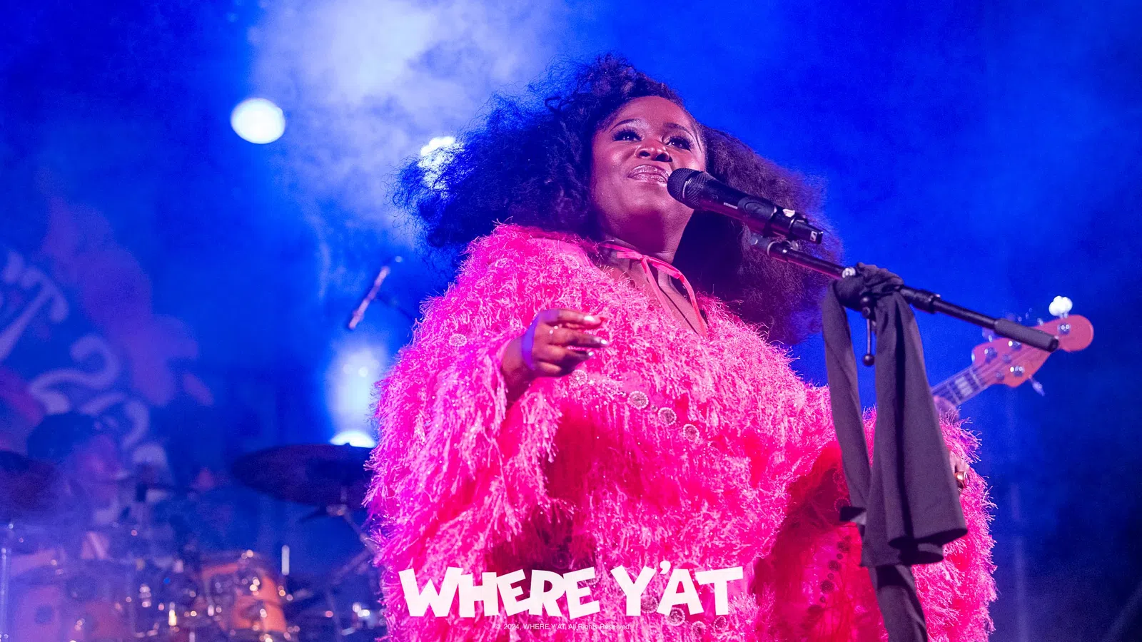 a person singing into a microphone