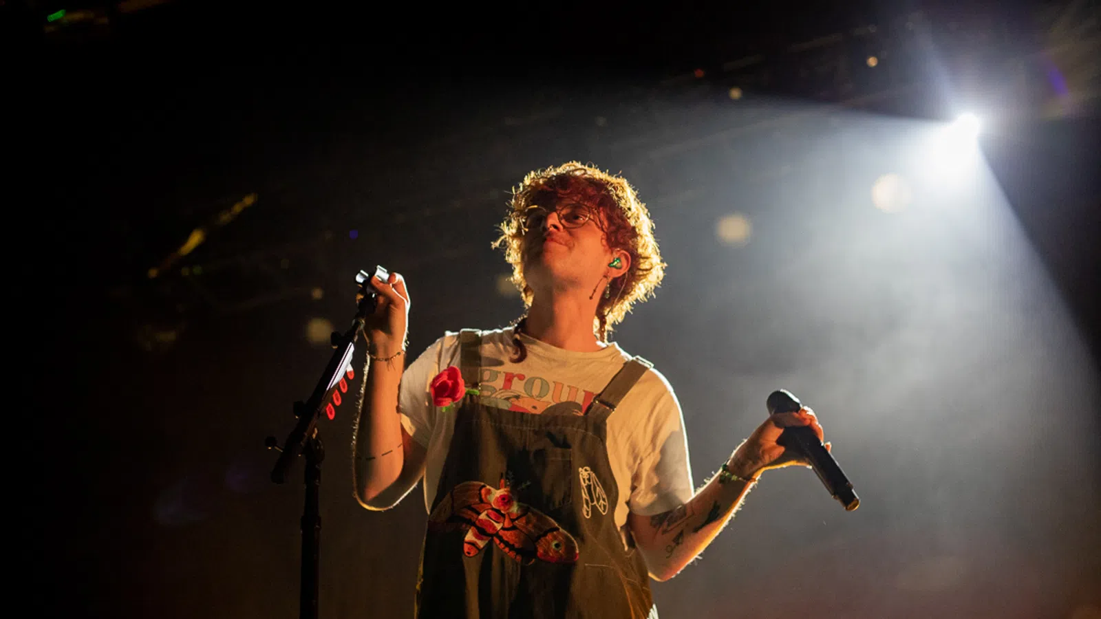 a person singing into a microphone