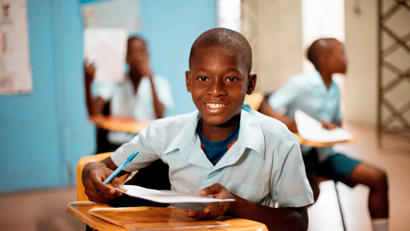 a young boy sitting at a table
