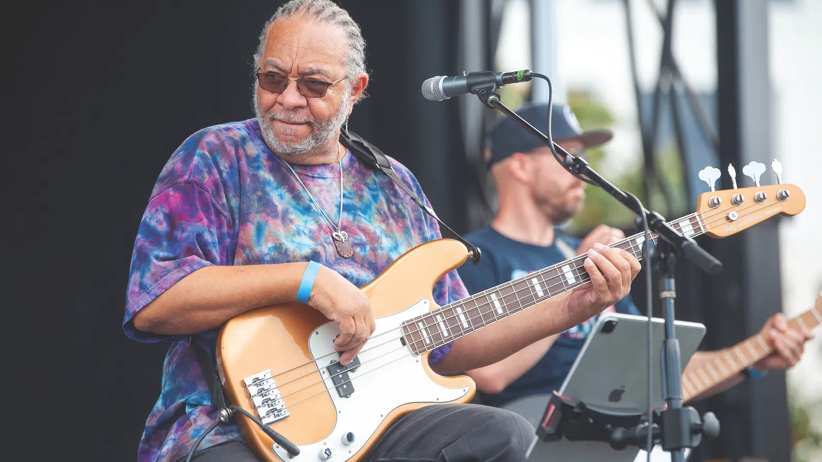 George Porter, Jr. playing a guitar
