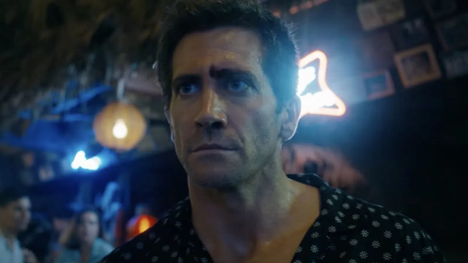 Jake Gyllenhaal with a black and white shirt and a black and white polka dot scarf
