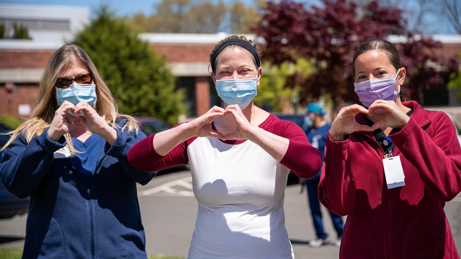 a group of women wearing face masks