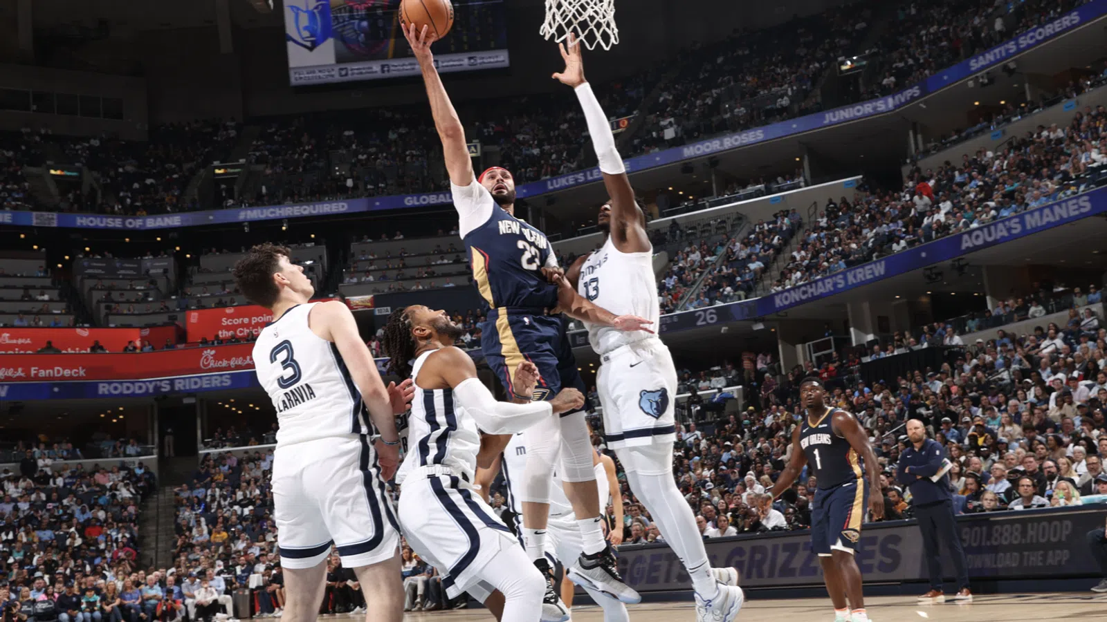 a group of men playing basketball