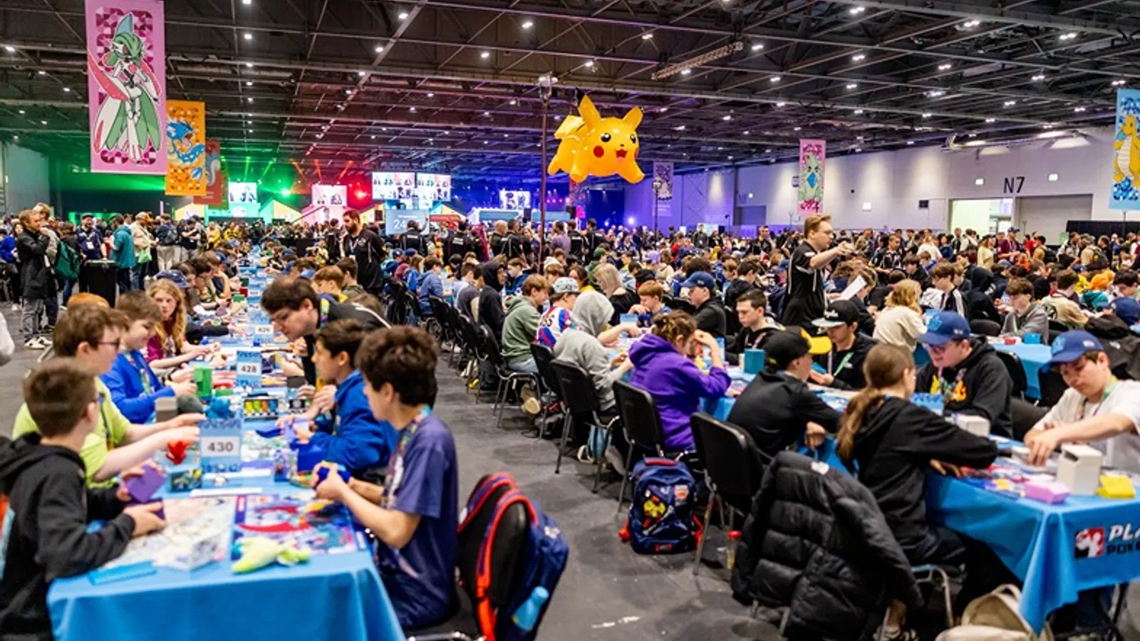 a group of people sitting at tables