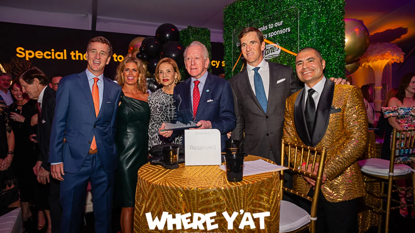 Rafael Natal, Eli Manning, Archie Manning, Cooper Manning posing for a photo