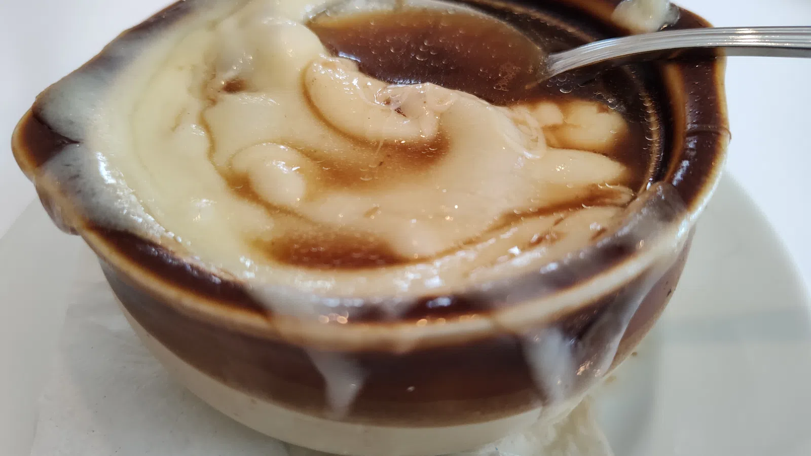a cup of coffee with a spoon