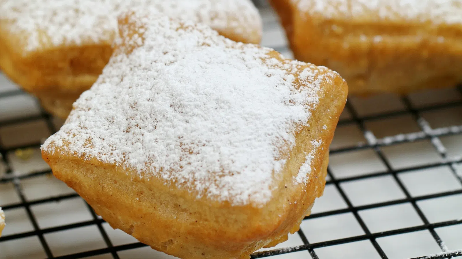 a couple of pastries on a cooling rack